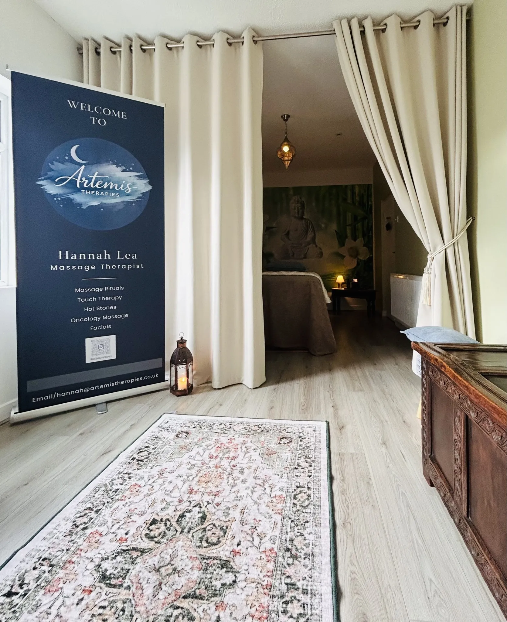 Soft curtains, warm light and a treatment bed at the Yoga Light Centre